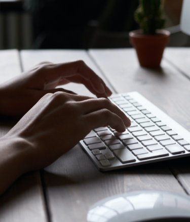 person typing on laptop