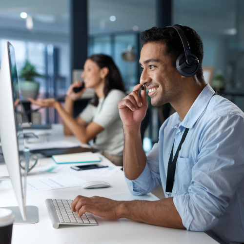 a man in office with headset on