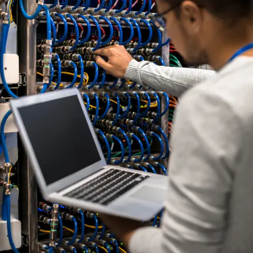 Network engineer working on server racks